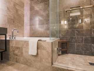 Bathroom Remodeling Ideas: Shower vs. Tub | Chatsworth A view at marble tiled bathroom with a shower and a tub
